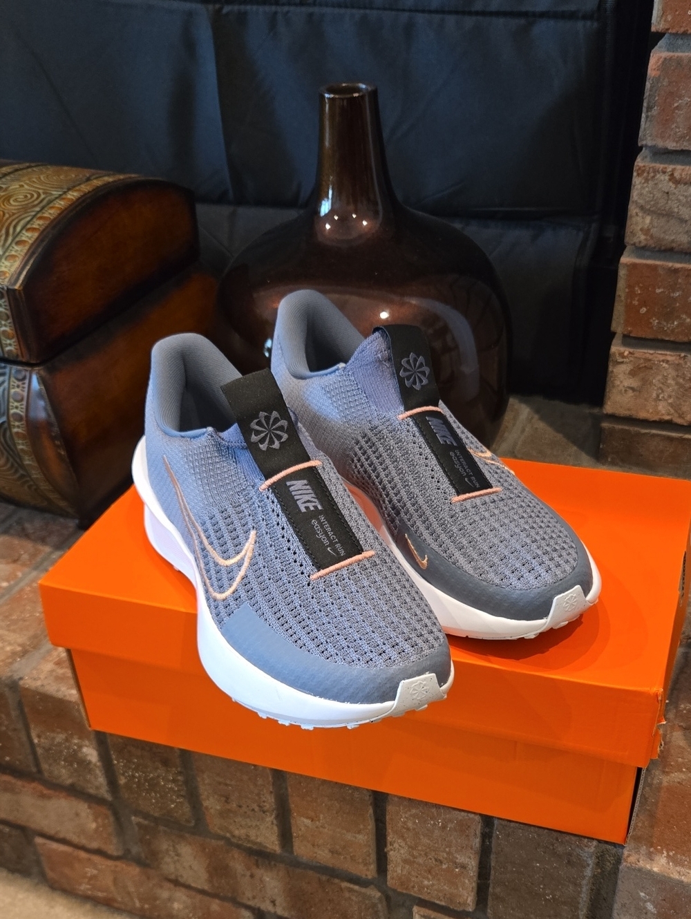 Nike Women’s Gray Athletic Slip-On Shoes with Peach Swoosh